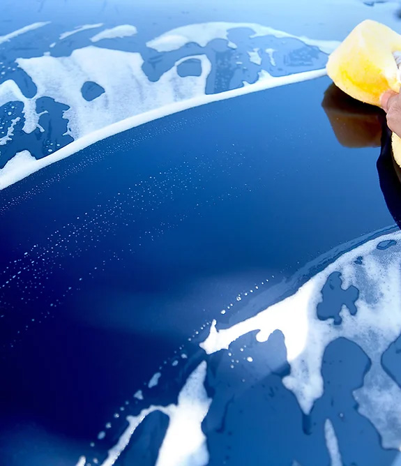 Blue car being washed